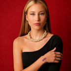 Ascendancy Gems Celestial Amethyst Bracelet with a large raw amethyst stone on a gold-tone wire cuff.