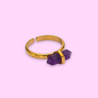 Ascendancy Gems gold ring with a double-terminated amethyst crystal set horizontally. Adjustable band.