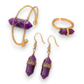 Ascendancy Gems Celestial Amethyst Collection: gold-tone bracelet, ring, and earrings with purple amethyst crystal points.