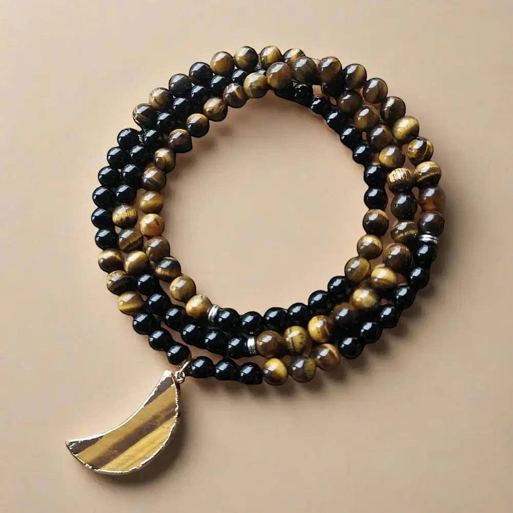 Ascendancy Gems 108-bead mala necklace with black onyx, tiger eye, and a gold-rimmed tiger eye moon pendant.
