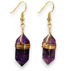 Ascendancy Gems Celestial Amethyst Earrings with gold wire wrap and gold hooks. Features faceted purple amethyst gemstones.