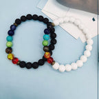 Ascendancy Gems Shakra Lava bead bracelets with black and white lava stones and colorful chakra beads.
