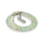 Ascendancy Gems handcrafted Ethiopian Welo fire opal bead necklace with rainbow play-of-color and adjustable chain.