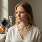 Ascendancy Gems Ethiopian fire opal beaded necklace worn by a woman in a white top with a soft, natural aesthetic.