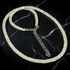 Ascendancy Gems handcrafted Ethiopian Welo fire opal bead necklace with rainbow play-of-color and adjustable chain.