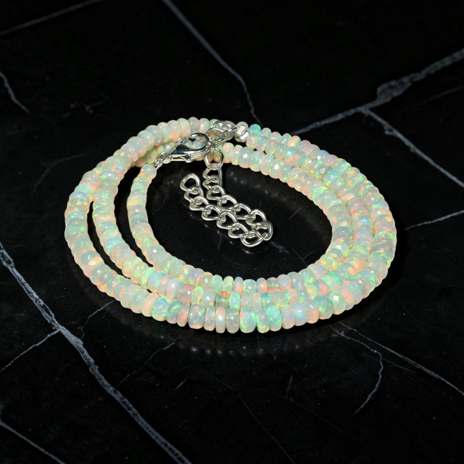 Ascendancy Gems handcrafted necklace featuring genuine Ethiopian Welo fire opal beads with vibrant rainbow play-of-color.