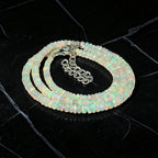 Ascendancy Gems handcrafted necklace featuring genuine Ethiopian Welo fire opal beads with vibrant rainbow play-of-color.