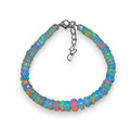 Ascendancy Gems handcrafted Ethiopian Welo opal bead bracelet with vibrant rainbow fire and adjustable metal clasp.