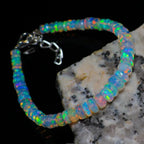 Ascendancy Gems handcrafted Ethiopian Welo opal bead bracelet featuring vibrant rainbow fire and adjustable clasp.
