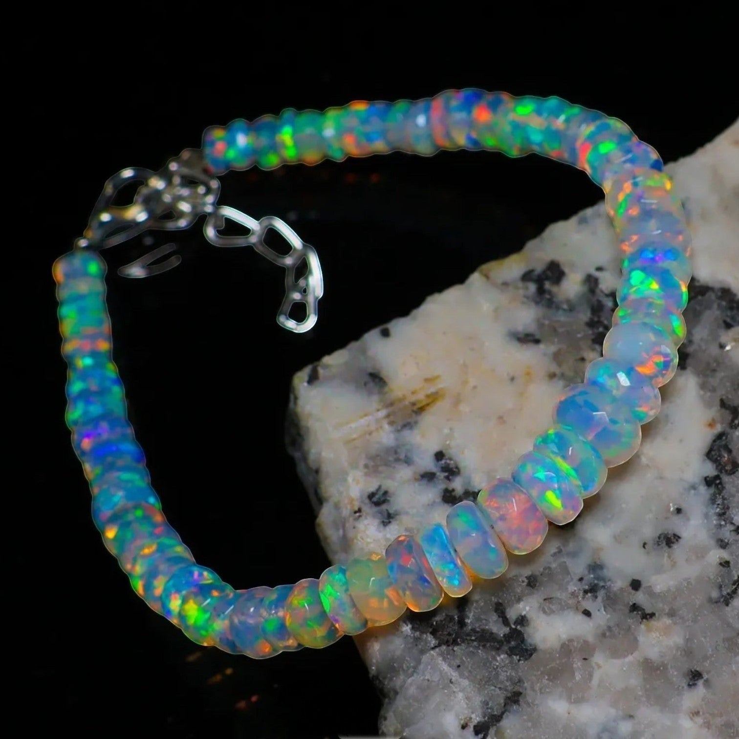 Ascendancy Gems handcrafted Ethiopian Welo opal bead bracelet featuring vibrant rainbow fire and adjustable clasp.