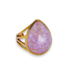 Ascendancy Gems gold-filled ring with a large, multifaceted teardrop amethyst gemstone. The band has a modern, open design.