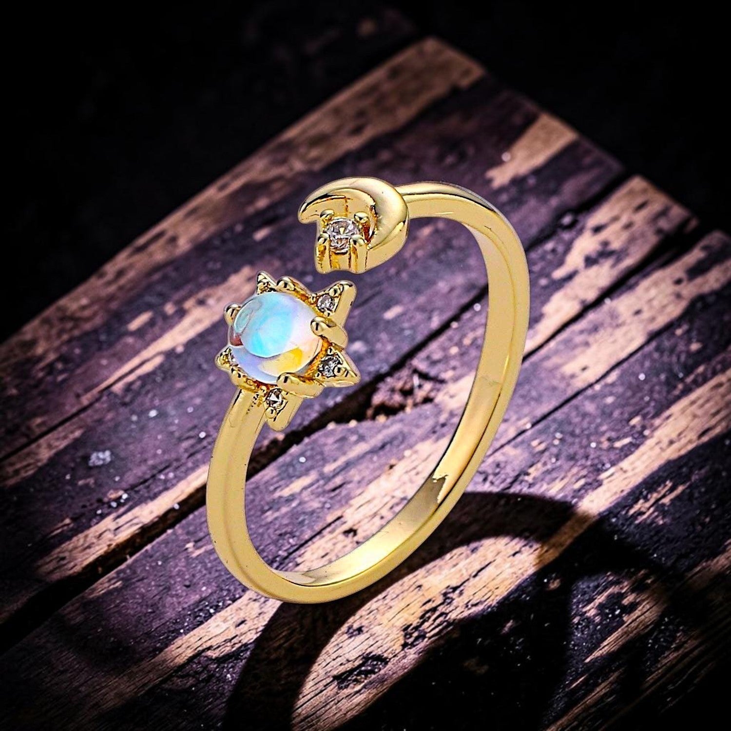 Ascendancy Gems gold plated adjustable ring with a moonstone center, star setting, and crescent moon accent.
