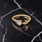 Ascendancy Gems gold plated sterling silver adjustable ring with moonstone, crescent moon, and star design.