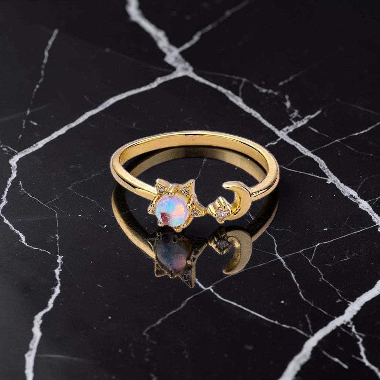 Ascendancy Gems gold plated sterling silver adjustable ring with moonstone, crescent moon, and star design.
