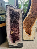 Ascendancy Gems large amethyst geode crystal formation with deep purple crystals and rough exterior.