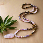Ascendancy Gems mala necklace with Tiger Eye, Amethyst, Rose Quartz, and Rhodonite beads and a Rose Quartz pendant.