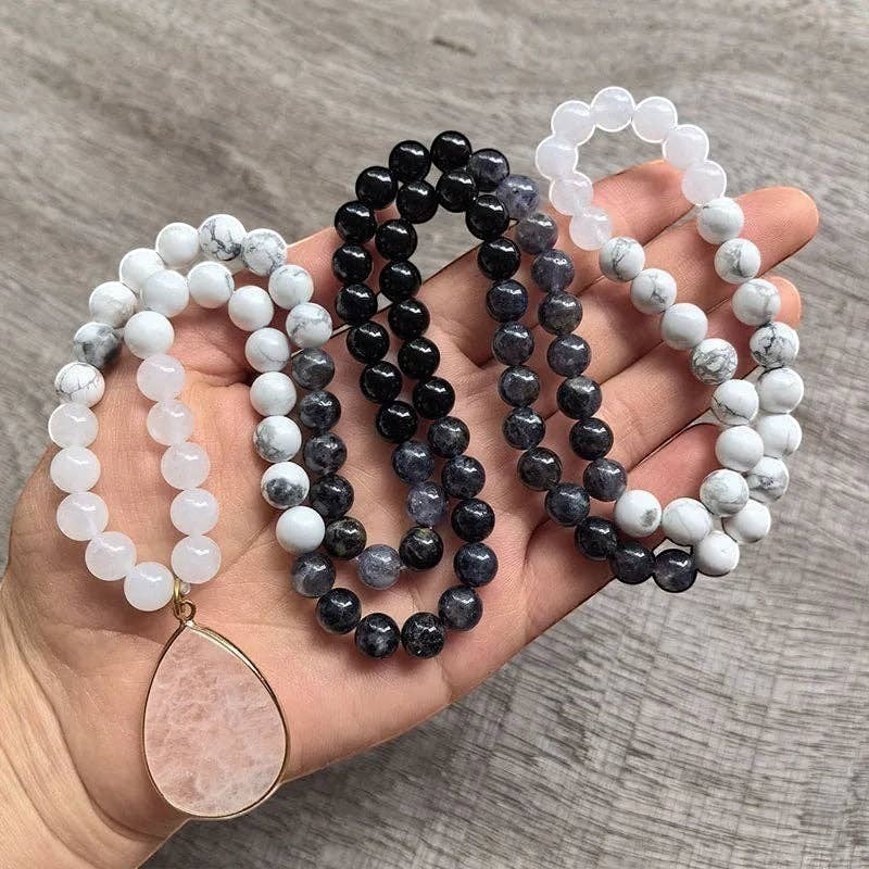 Ascendancy Gems Awakening Mala Set: 108-bead necklace with white howlite, onyx, quartz beads and rose quartz pendant, plus matching bracelet.