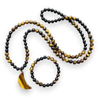 Ascendancy Gems 108-bead mala necklace and bracelet set with black onyx, tiger eye, and a crescent moon pendant.