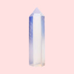Ascendancy Gems polished opalite crystal tower, 3" obelisk with blue and peach tones, smooth finish, ideal for decor and meditation.