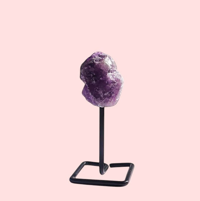 Ascendancy Gems raw amethyst crystal on minimalist black metal stand, approx. 4 inches tall.