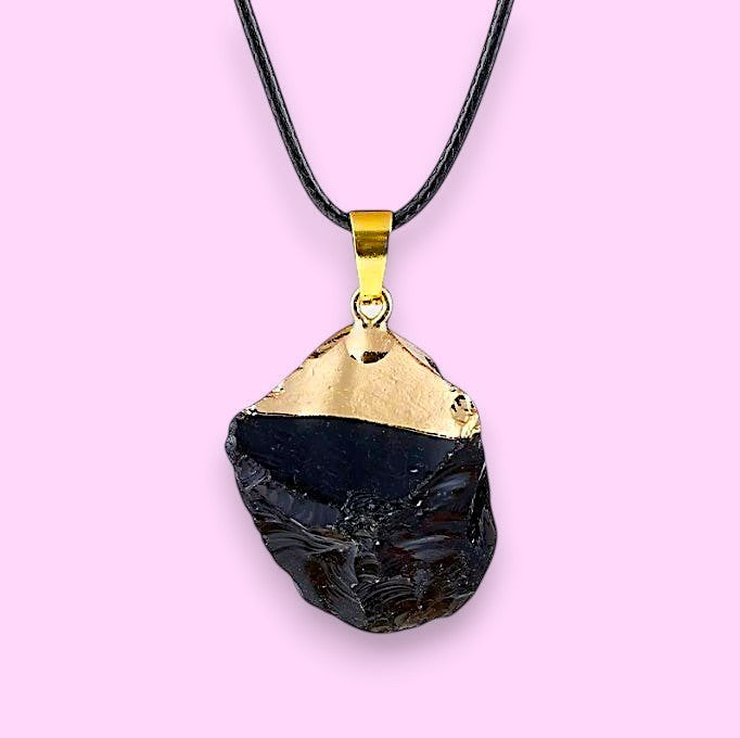 Ascendancy Gems raw black obsidian crystal necklace with gold cap and leather cord. Natural, irregular shape.