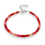 Ascendancy Gems handcrafted bracelet featuring faceted red Ethiopian Welo fire opal rondelle beads and silver clasp.