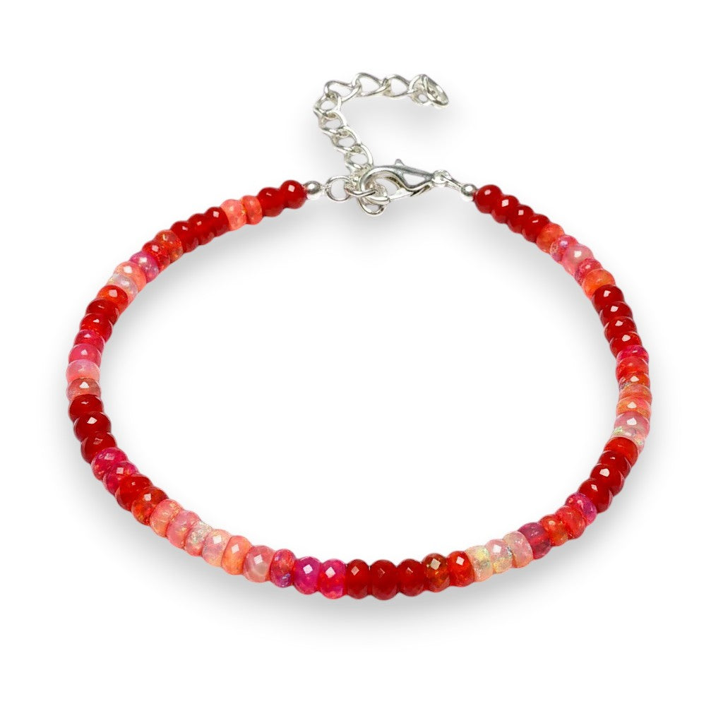 Ascendancy Gems handcrafted bracelet featuring faceted red Ethiopian Welo fire opal rondelle beads and silver clasp.