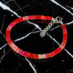 Ascendancy Gems handcrafted bracelet featuring faceted red Ethiopian Welo fire opal beads with a silver clasp.