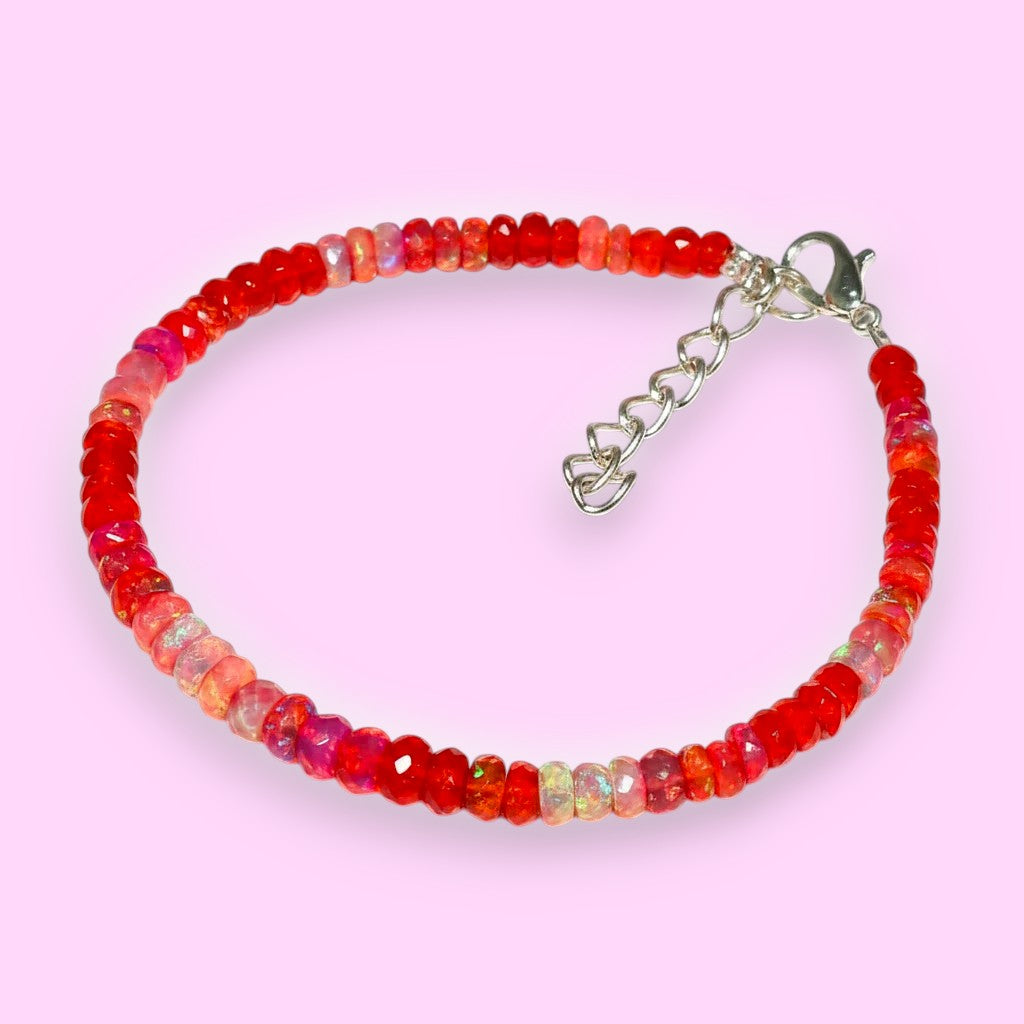 Ascendancy Gems handcrafted bracelet with faceted red Ethiopian Welo fire opal rondelle beads and silver clasp.