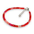Ascendancy Gems handcrafted bracelet with faceted red Ethiopian Welo fire opal rondelle beads and silver clasp.
