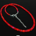 Ascendancy Gems handcrafted necklace featuring vibrant red Ethiopian Welo fire opal rondelle beads with silver clasp.