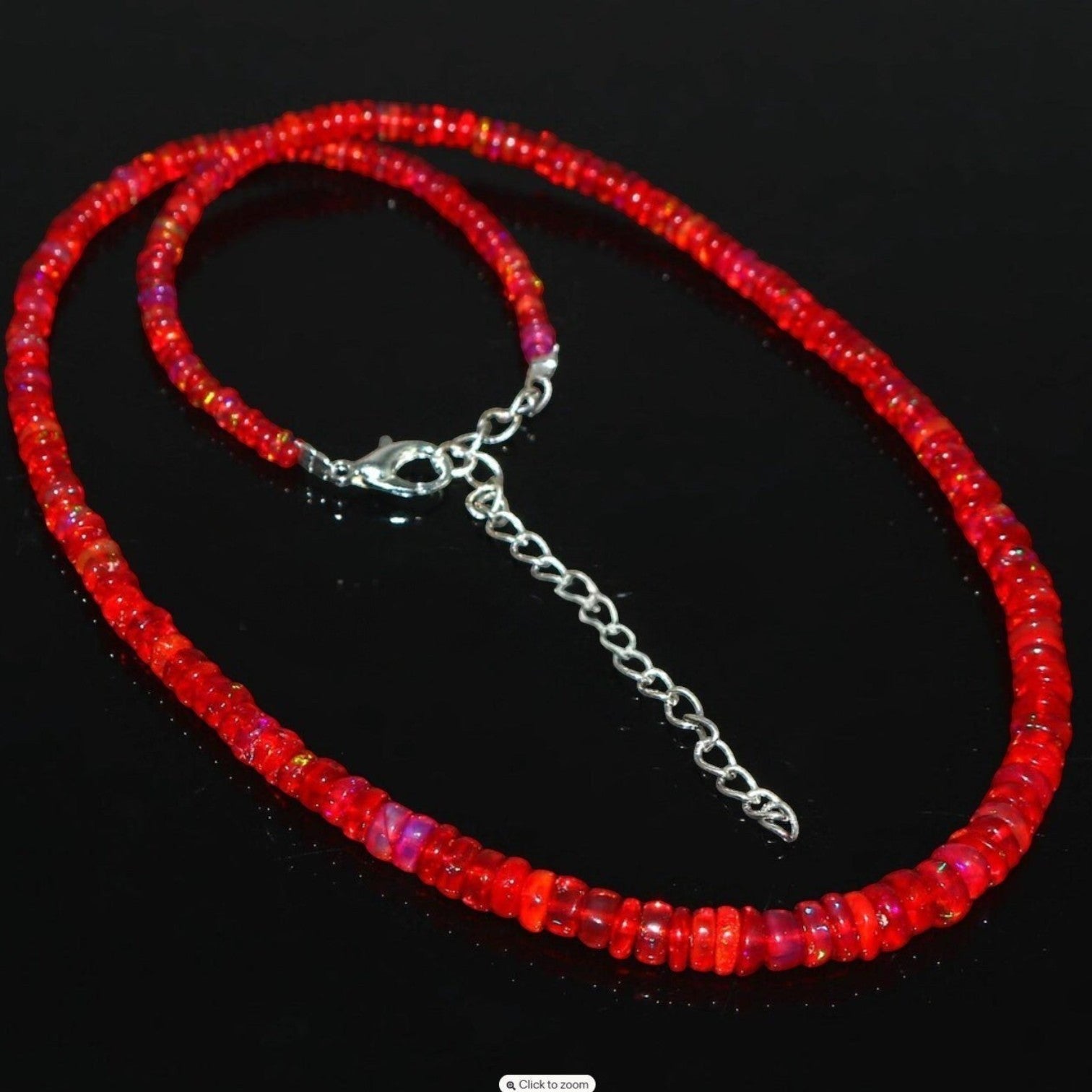 Ascendancy Gems handcrafted necklace featuring vibrant red Ethiopian Welo fire opal rondelle beads with silver clasp.