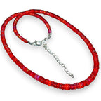 Ascendancy Gems handcrafted necklace featuring vibrant red Ethiopian Welo fire opal rondelle beads with silver clasp.