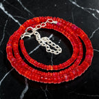 Ascendancy Gems handcrafted necklace featuring vibrant red Ethiopian Welo fire opal rondelle beads with silver clasp.