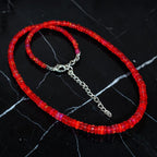 Ascendancy Gems handcrafted necklace featuring vibrant red Ethiopian Welo fire opal rondelle beads with silver clasp.