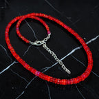Ascendancy Gems handcrafted necklace featuring vibrant red Ethiopian Welo fire opal rondelle beads with silver clasp.
