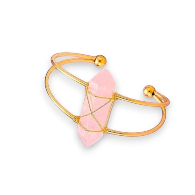 Ascendancy Gems Celestial Rose Quartz Bracelet with a raw pink quartz crystal wrapped in gold wire on a gold cuff.