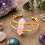 Ascendancy Gems Celestial Rose Quartz Bracelet with a gold-tone wire-wrapped pink quartz crystal centerpiece.