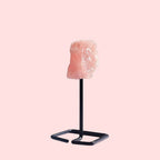 Ascendancy Gems raw rose quartz crystal on a minimalist black metal stand, approx. 4 inches tall.