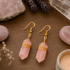 Ascendancy Gems Celestial Rose Quartz Earrings with gold wire wrapping and hooks, featuring polished pink quartz points.