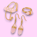 Ascendancy Gems Celestial Rose Quartz Collection: bracelet, ring, and earrings with pink crystals and gold-tone wire accents.