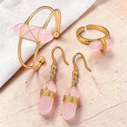 Ascendancy Gems Celestial Rose Quartz jewelry set featuring a wire-wrapped crystal bracelet, ring, and dangle earrings.